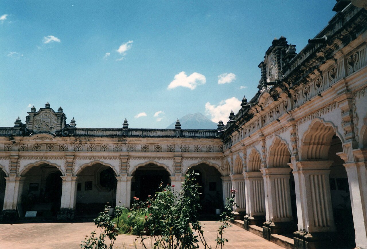 Colonial architecture street in the Antigua Guatemala area with colorful buildings and cobblestone road