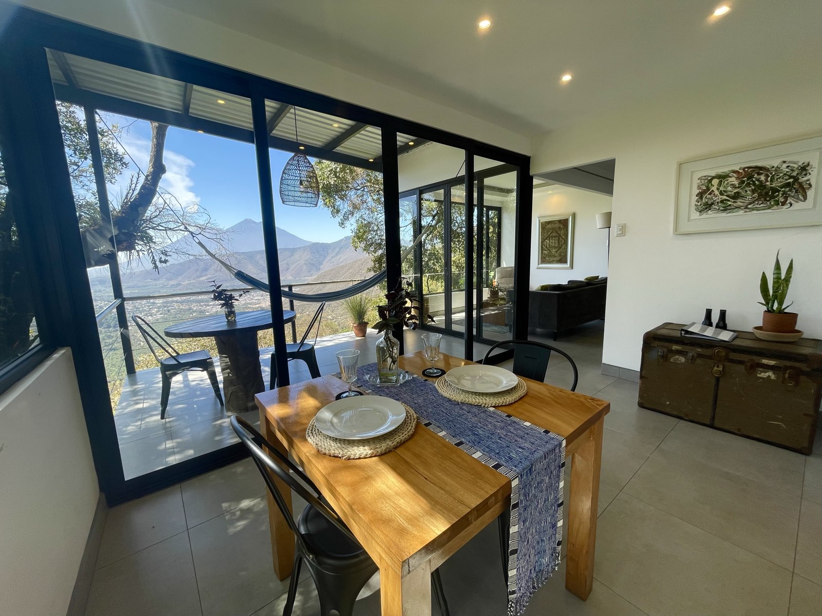 Spacious modern apartment with panoramic volcano views and private terrace surrounded by forest at Finca El Tambor, El Hato, Antigua Guatemala